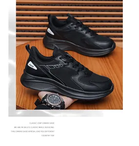 Detail of black sporty sneakers showing breathable mesh upper and thick cushioned midsole