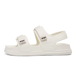 Side view of white platform sports sandals with adjustable velcro straps and SPORT logo