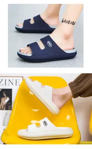 Detailed close-up of non-slip EVA slippers in navy and white with thick soles and sport logo
