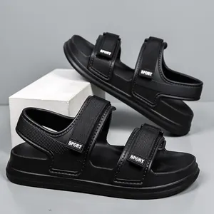 Close-up of black sport sandals featuring adjustable straps and textured EVA material
