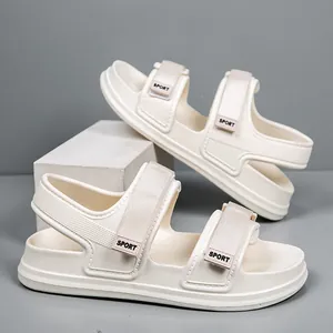 Detail of cream sporty sandals with adjustable velcro straps and cushioned EVA sole