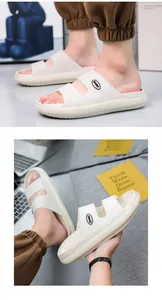 Close-up of cream thick-sole EVA slides featuring dual straps and sport logo detail