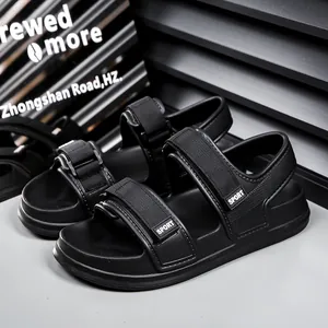 Close-up of black sports sandals with EVA thick soles and SPORT logo velcro straps