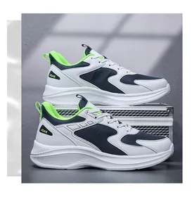 Detail view of navy blue mesh and white faux leather sneakers with neon green lining