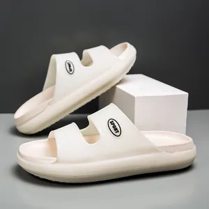 Detail showing the thick EVA sole and SPORT logo on cream-colored double strap sandals