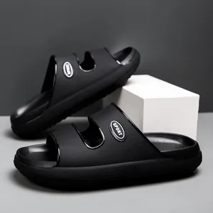Detail view of black EVA sports slides featuring dual-strap hollow design and SPORT logo