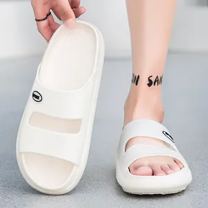 Close-up of beige EVA slippers featuring flexible dual-strap design and Sport logo
