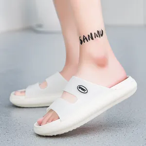 On-foot view of white double-strap EVA slide sandals with Sport logo and thick soles