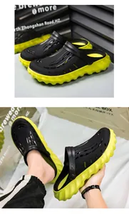 Λεπτομερής όψη των μαύρων και πράσινων clogs πλατφόρμας με χοντρές αντιολισθητικές σόλες