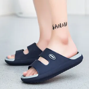 Detail view of charcoal grey EVA foam slide sandal showing thick sole and side sport logo