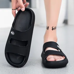 Close-up of black double-strap sport slide sandals with thick EVA sole and anti-slip texture