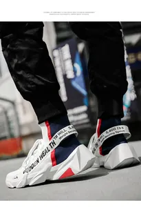 Detail of the high-top knit sock sneaker with a thick geometric sole and urban industrial style