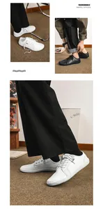 Dettaglio di eleganti scarpe barefoot in pelle bianca e nera con punta ampia e piatta