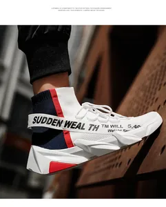 Macro detail of white knit sock sneaker with high-top design and red heel accent