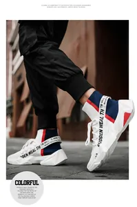 Street-style macro view of breathable high-top knit sneakers with red and blue accents