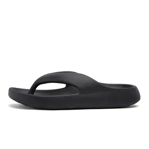 Side view of black EVA flip flops with thick platform sole and non-slip texture