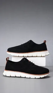 Detail of breathable knitted mesh fabric and flexible foam sole on casual black sneakers