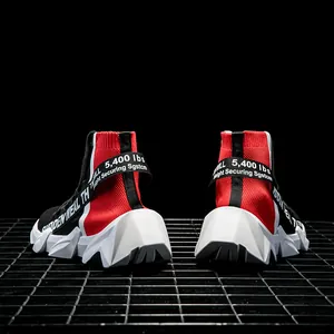 Detailed back view of high-top knit sneakers featuring red lettering on black straps