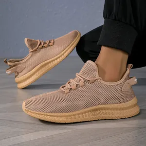 Macro shot of breathable mesh texture and heel design details of khaki athletic shoes