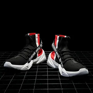 Detailed view of high-top sock sneakers with black knit upper and thick white geometric soles
