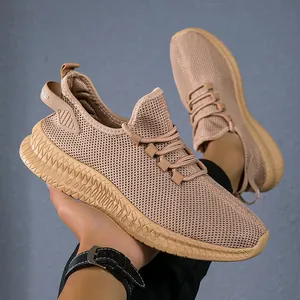 Detail of khaki breathable mesh fabric and durable non-slip rubber sole of men's running shoe
