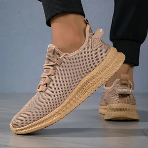 Close-up of khaki breathable mesh running shoes with thick anti-slip rubber soles