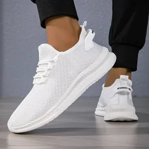 Close-up of white breathable mesh sneakers featuring thick non-slip soles and rear pull tabs