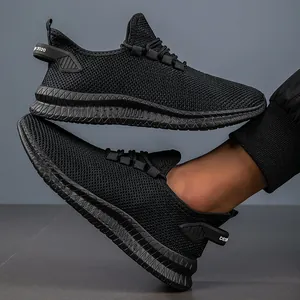 Macro view of breathable black knit mesh upper and thick textured sole on running shoes