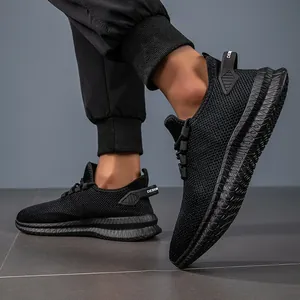 Dynamic side view of breathable black knit running shoes with thick rubber soles