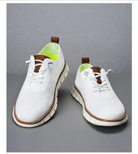 Detail of white flyknit loafers with brown leather accents and fluorescent yellow lining