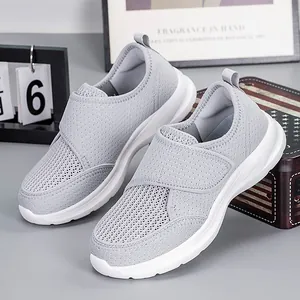 Light grey breathable mesh walking shoes with adjustable hook-and-loop straps and thick sole