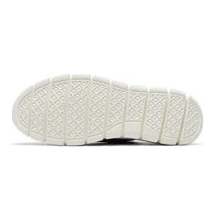 Macro view of cream-white flexible rubber outsole with anti-slip diamond pattern