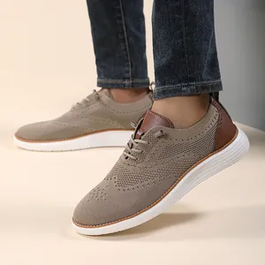 Close-up of breathable knit fabric and brogue wingtip details on casual men's loafers