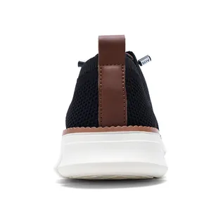 Close-up of the breathable mesh heel and brown leather pull tab on these men's casual shoes