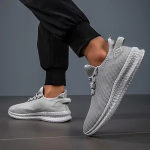 Close-up of lightweight grey mesh running shoes with breathable texture and thick saw-tooth sole