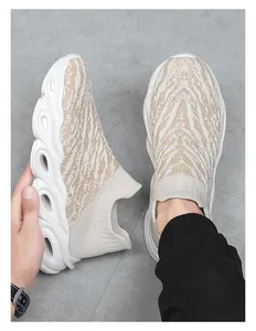 Close-up of khaki knit slip-on sneakers featuring a cushioned hollowed-out sole design