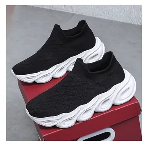 Detail of breathable knit upper and hollowed EVA sole on men's slip-on sneaker
