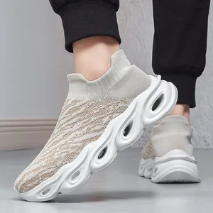 Men's slip-on knit walking shoes with breathable beige fabric and thick hollowed soles