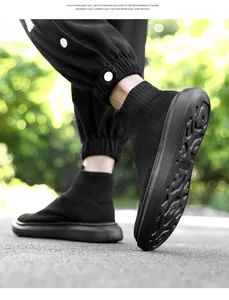 Close-up of black breathable knit sock sneaker with chunky non-slip rubber sole detail