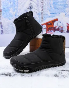 Detail view of black waterproof snow boots with warm faux fur lining and side zipper