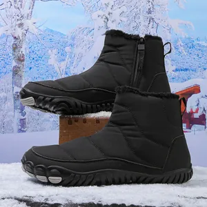 Detail of waterproof quilted snow boots with thick faux fur lining and side zipper