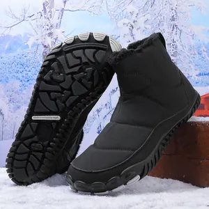 Detail view of anti-slip rubber outsole and warm faux fur lining on black snow boots