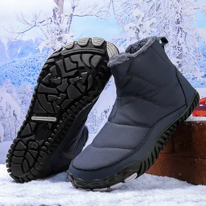 Detail view of navy waterproof snow boot with thick faux fur lining and anti-slip rubber sole