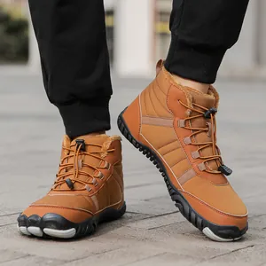 Close-up of brown winter snow boots featuring warm yellow fur lining and durable lace locks