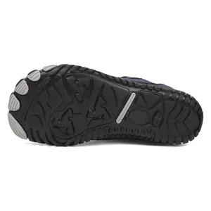 Close-up of waterproof winter boots durable rubber sole with anti-slip tread pattern