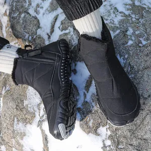 Waterproof black winter snow boots with quilted fabric, side zipper and faux fur lining
