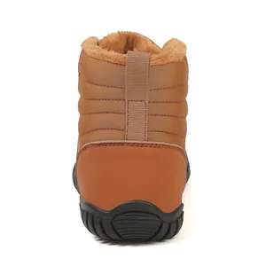 Rear view showing brown quilted nylon, leather heel support and warm faux fur lining on snow boots