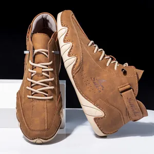Macro view of retro brown leather boots with unique wavy rubber sole and detailed stitching