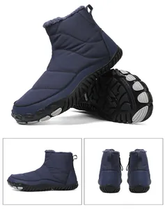 Detail view of dark blue waterproof snow boots with warm plush lining and non-slip rubber soles