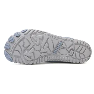 Detailed macro view of the non-slip rubber sole and split-toe design for snow boots